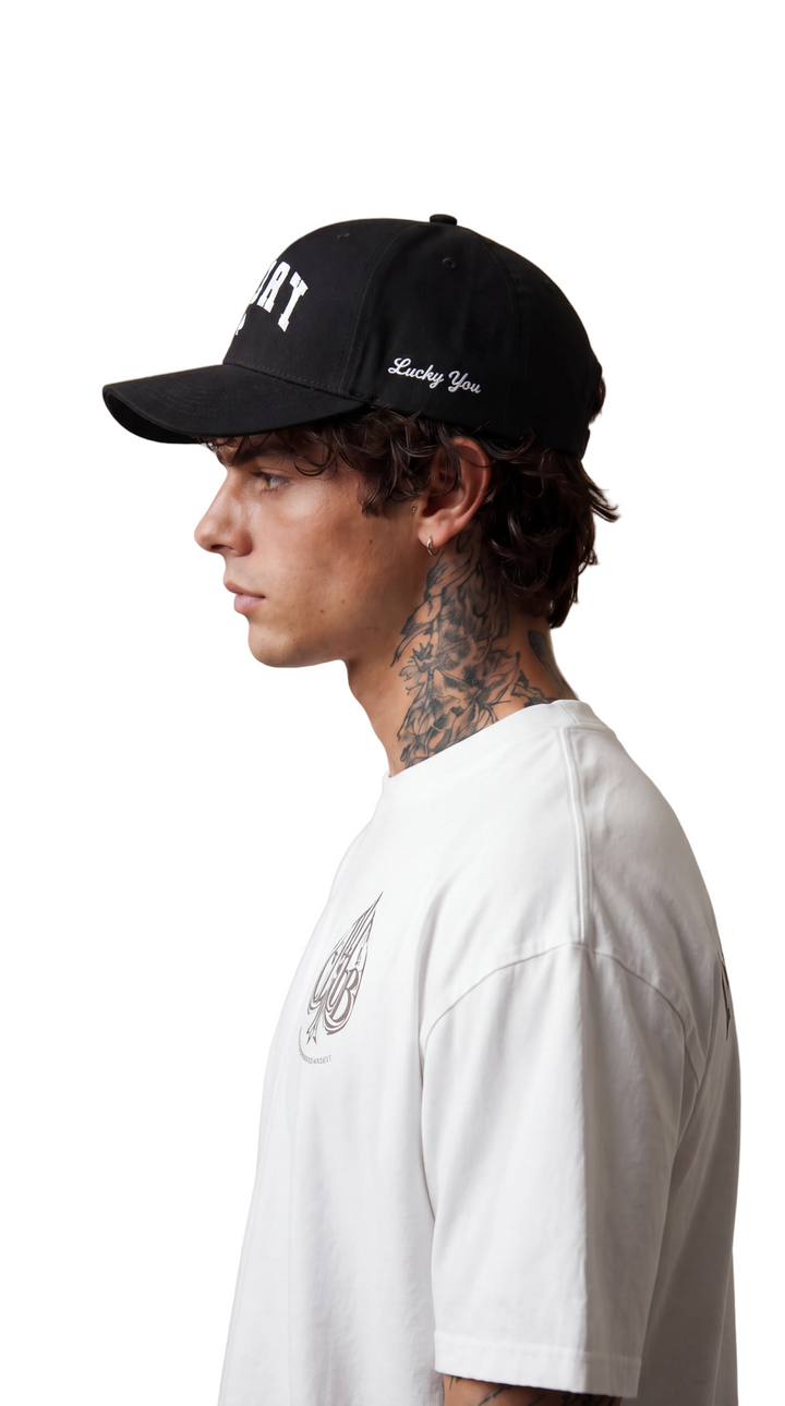 Black Lucky Spade cap with white embroidered lettering and spade, Tilted Spades