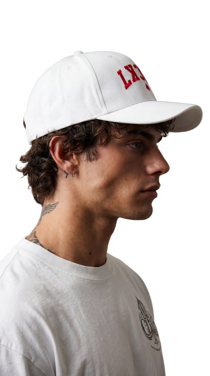 Side-profile portrait showing the Lucky Spade cap in profile, Tilted Spades