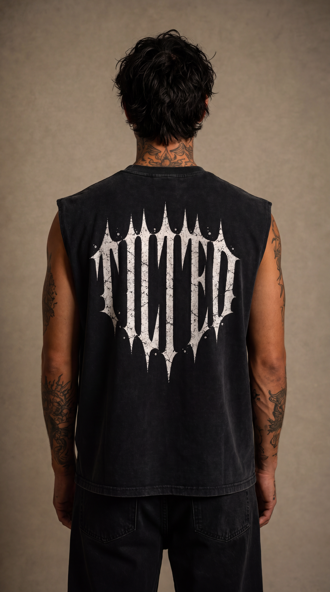 Back view of the black sleeveless Tilted tank top, beige studio, Tilted Spades