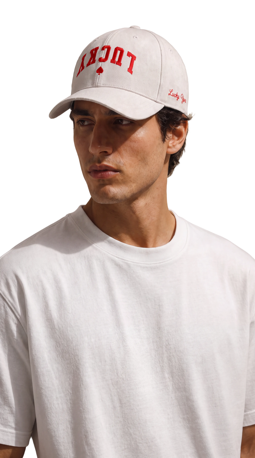 Close-up portrait wearing the Lucky Spade Snapback, Tilted Spades