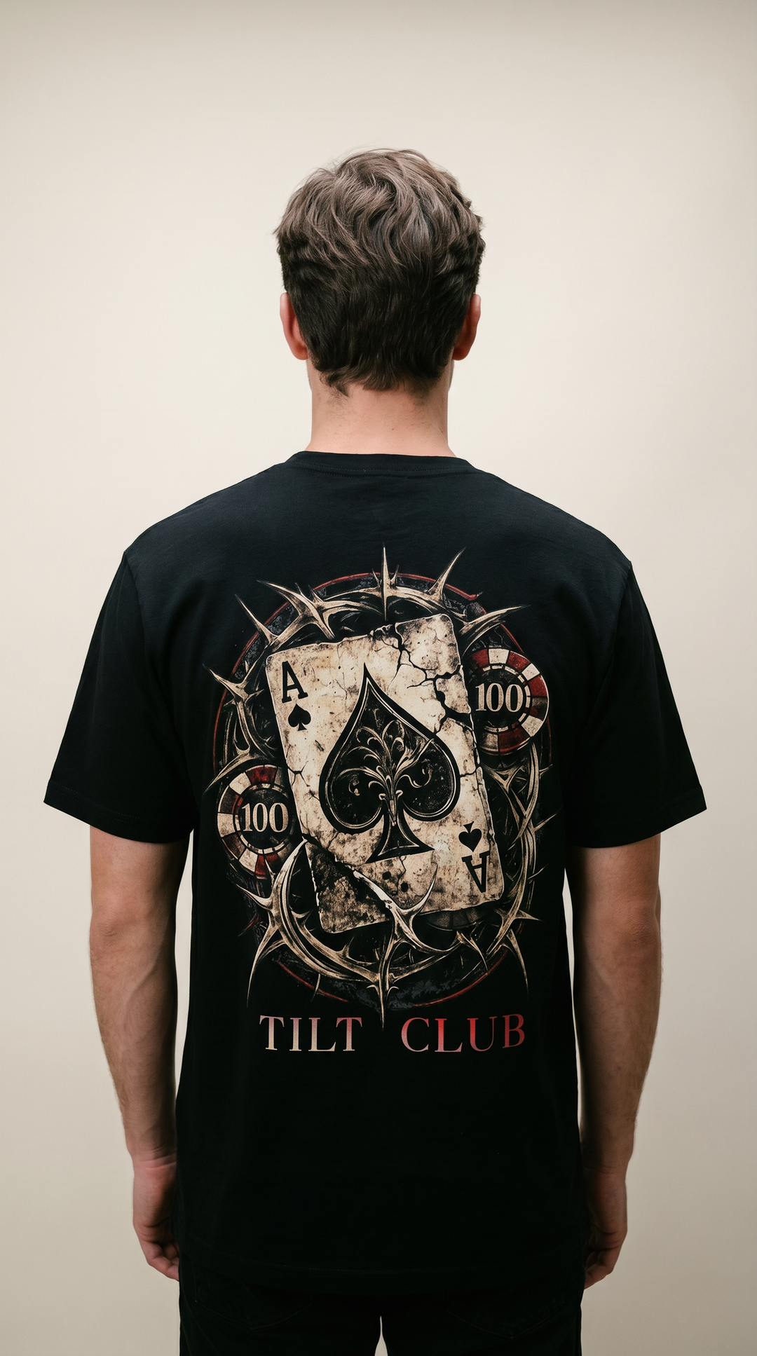 Model wearing the back design of the Crown of Risk spade graphic shirt, Tilted Spades