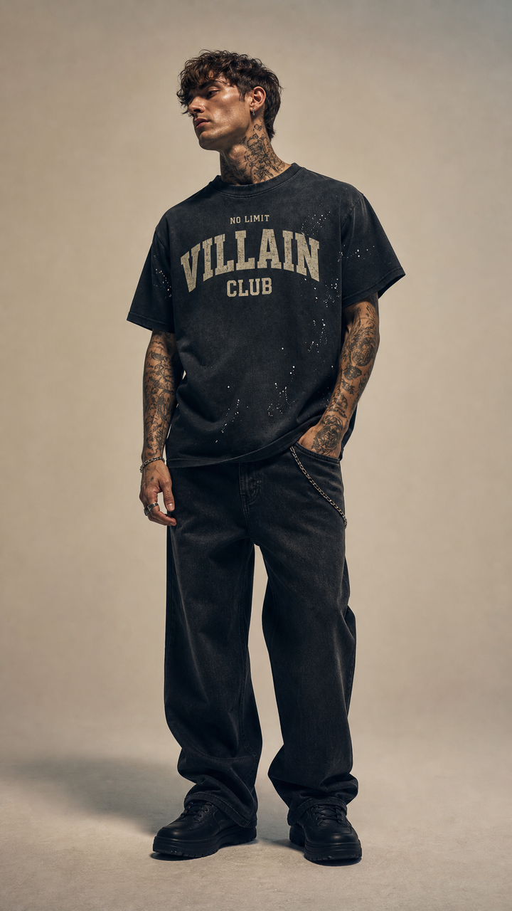 Male model with tattoos wearing the Villain Club sunfade tee, white studio, Tilted Spades