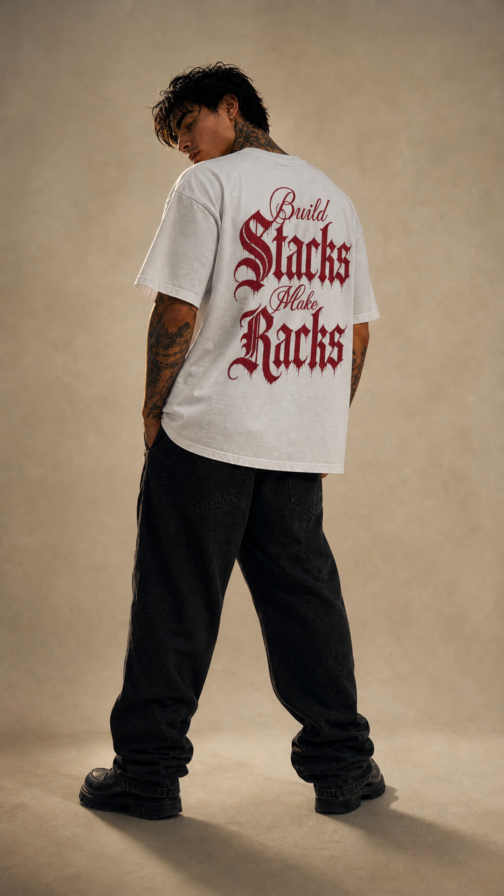 Model wearing the back design of the Ascend enzyme washed tee, white studio, Tilted Spades
