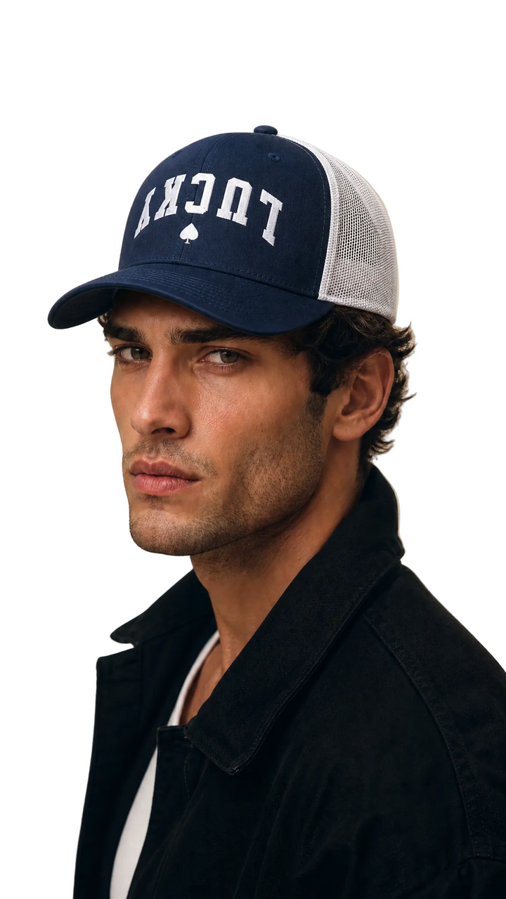 Lucky Spade trucker cap in navy blue with white collegiate lettering, Tilted Spades