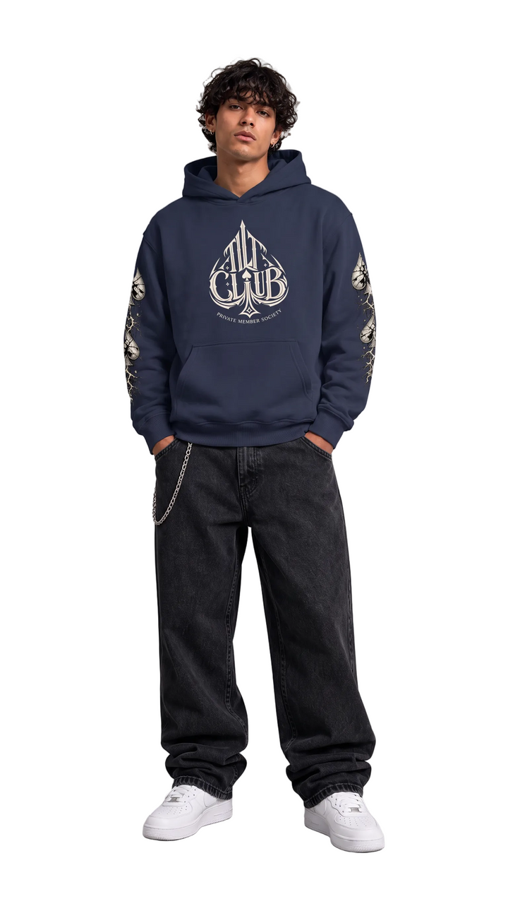Model wearing The Club Hoodie in navy blue pullover style, Tilted Spades
