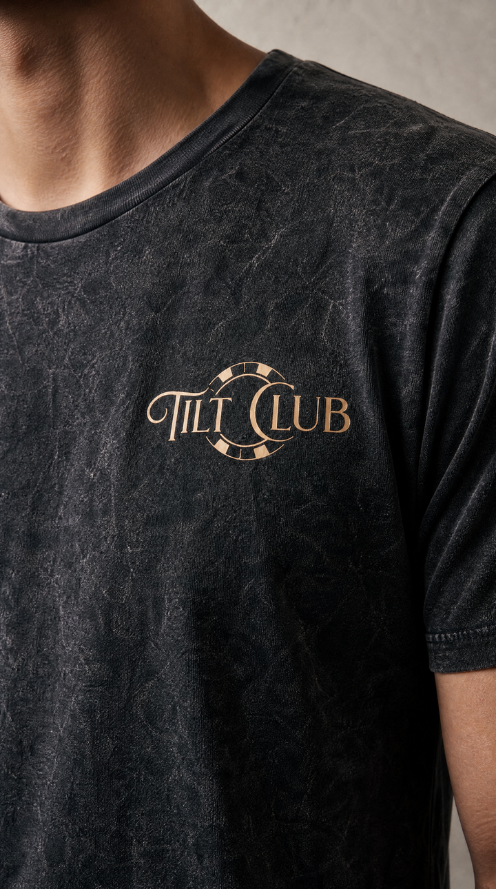 Model wearing a washed poker graphic tee by Tilted Spades