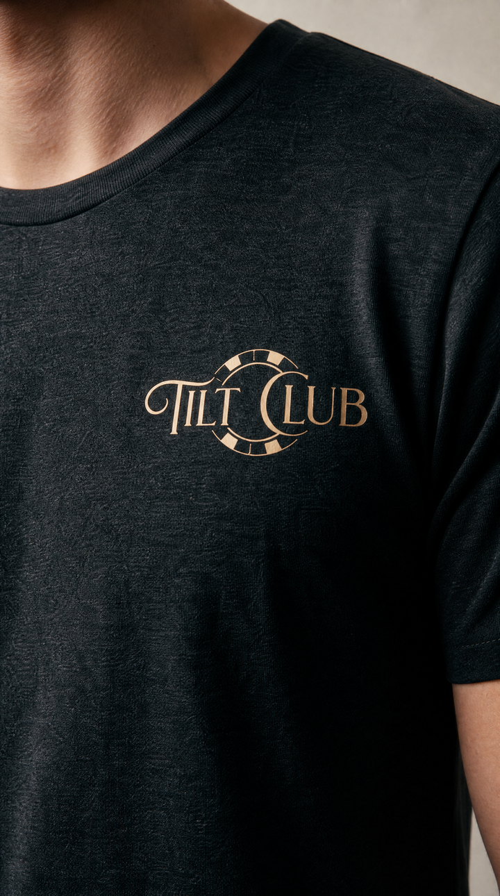 Model wearing a black poker graphic tee by Tilted Spades