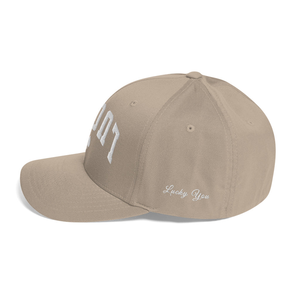 Khaki closed-back structured cap mockup, left side view, Tilted Spades
